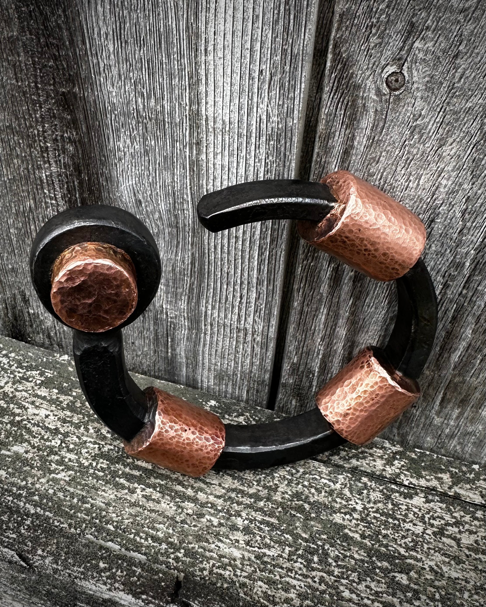 Forged steel, cast & hammered copper, with waxed hot finish