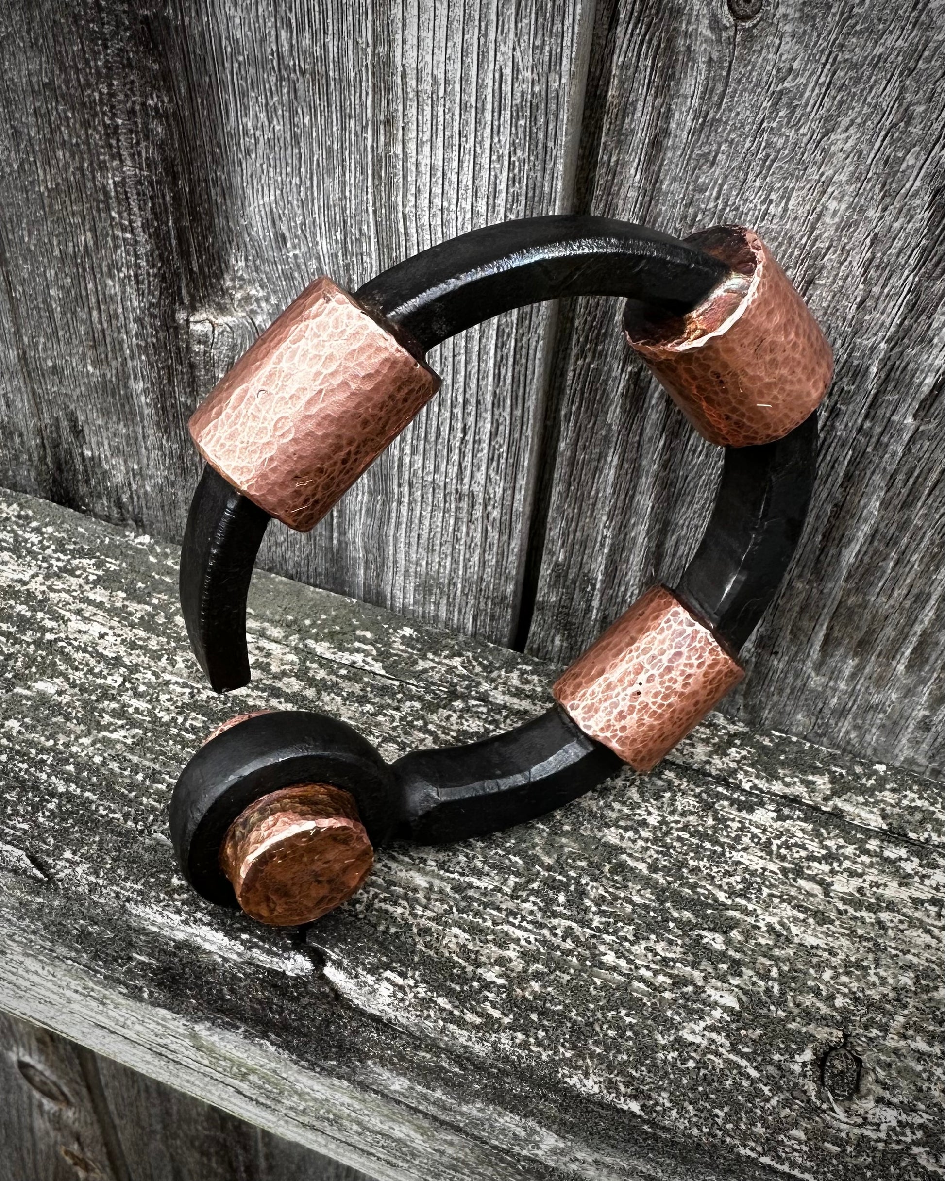 Forged steel, cast & hammered copper, with waxed hot finish