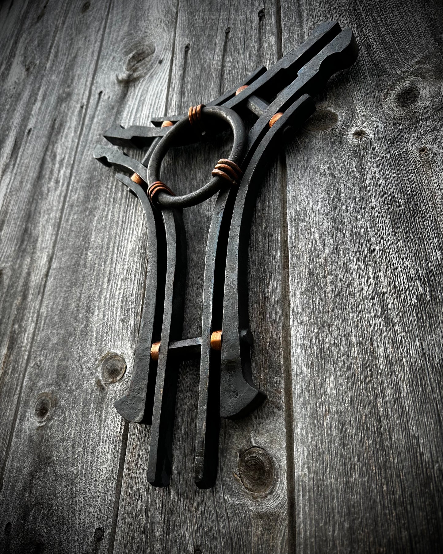 Forged steel & copper with waxed hot finish.