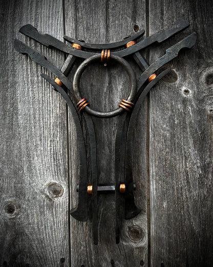 Forged steel & copper with waxed hot finish.