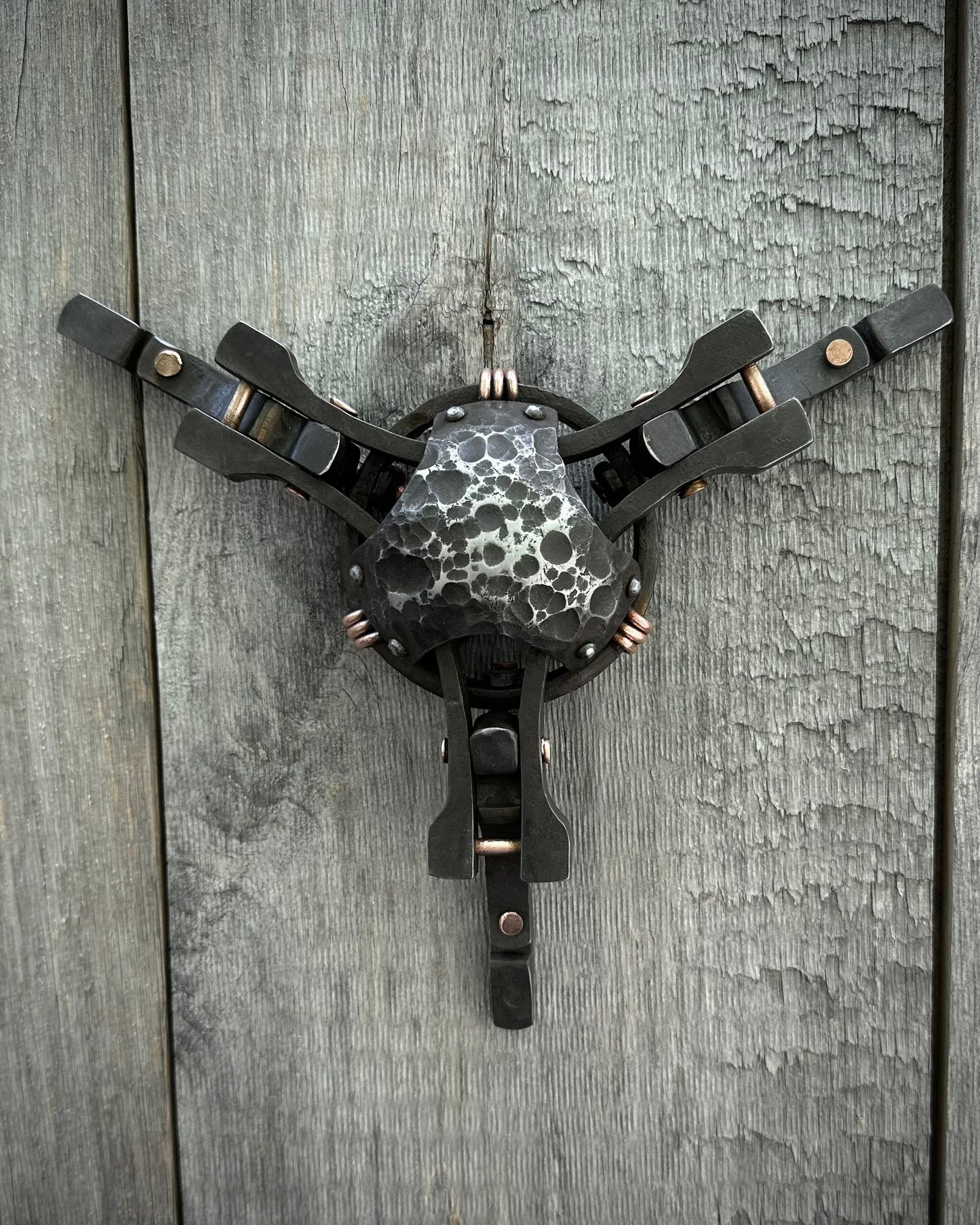 Forged steel & copper with waxed hot finish.