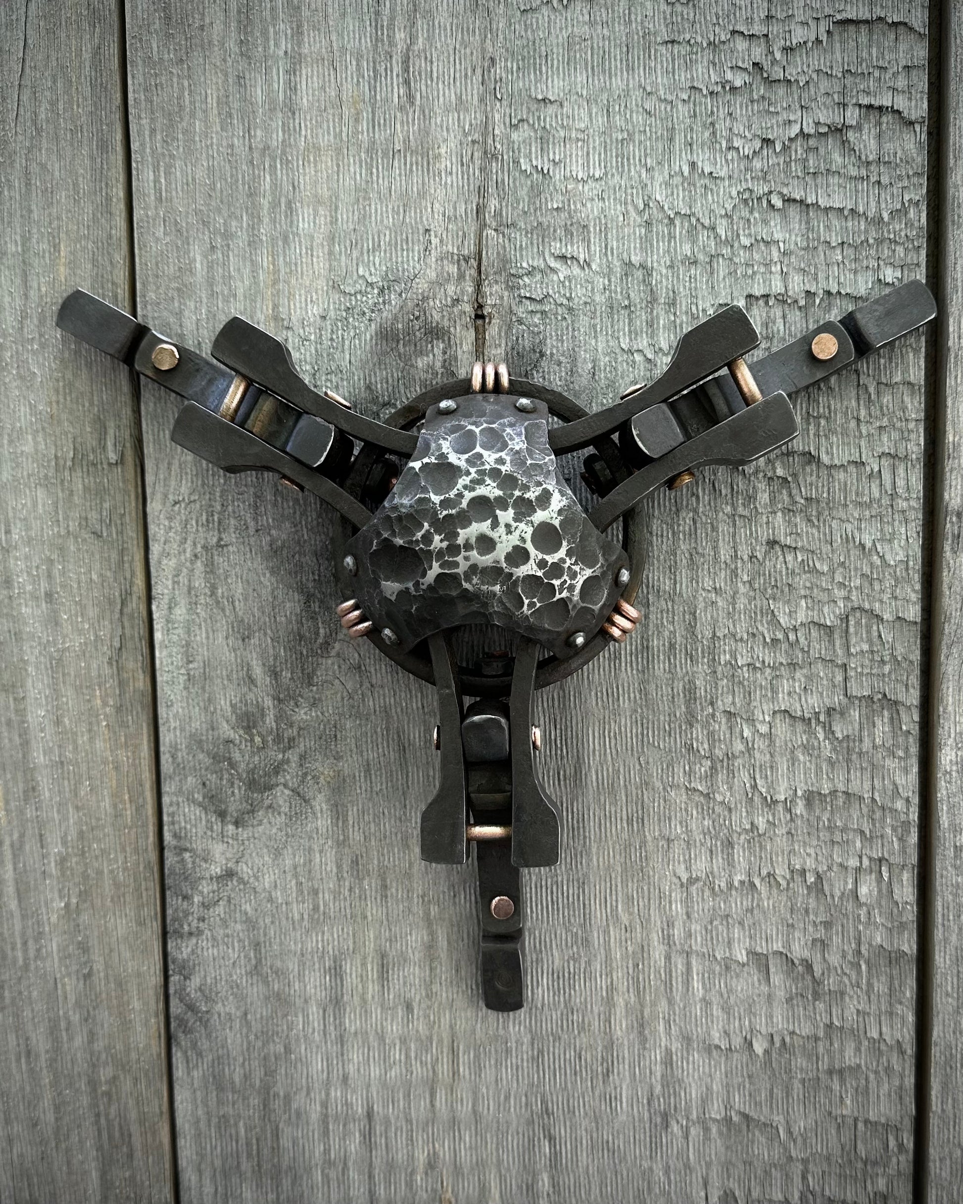 Forged steel & copper with waxed hot finish.