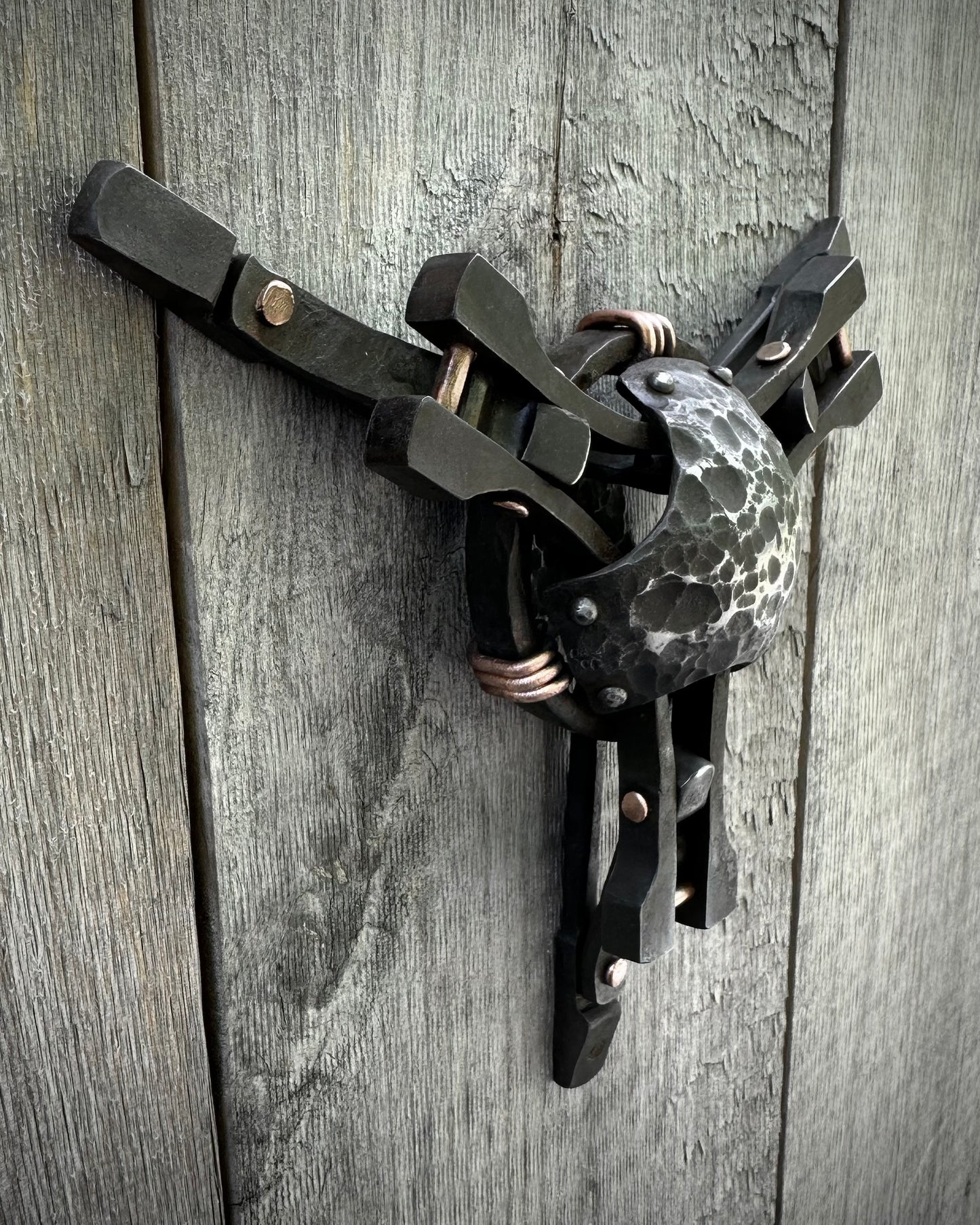 Forged steel & copper with waxed hot finish.