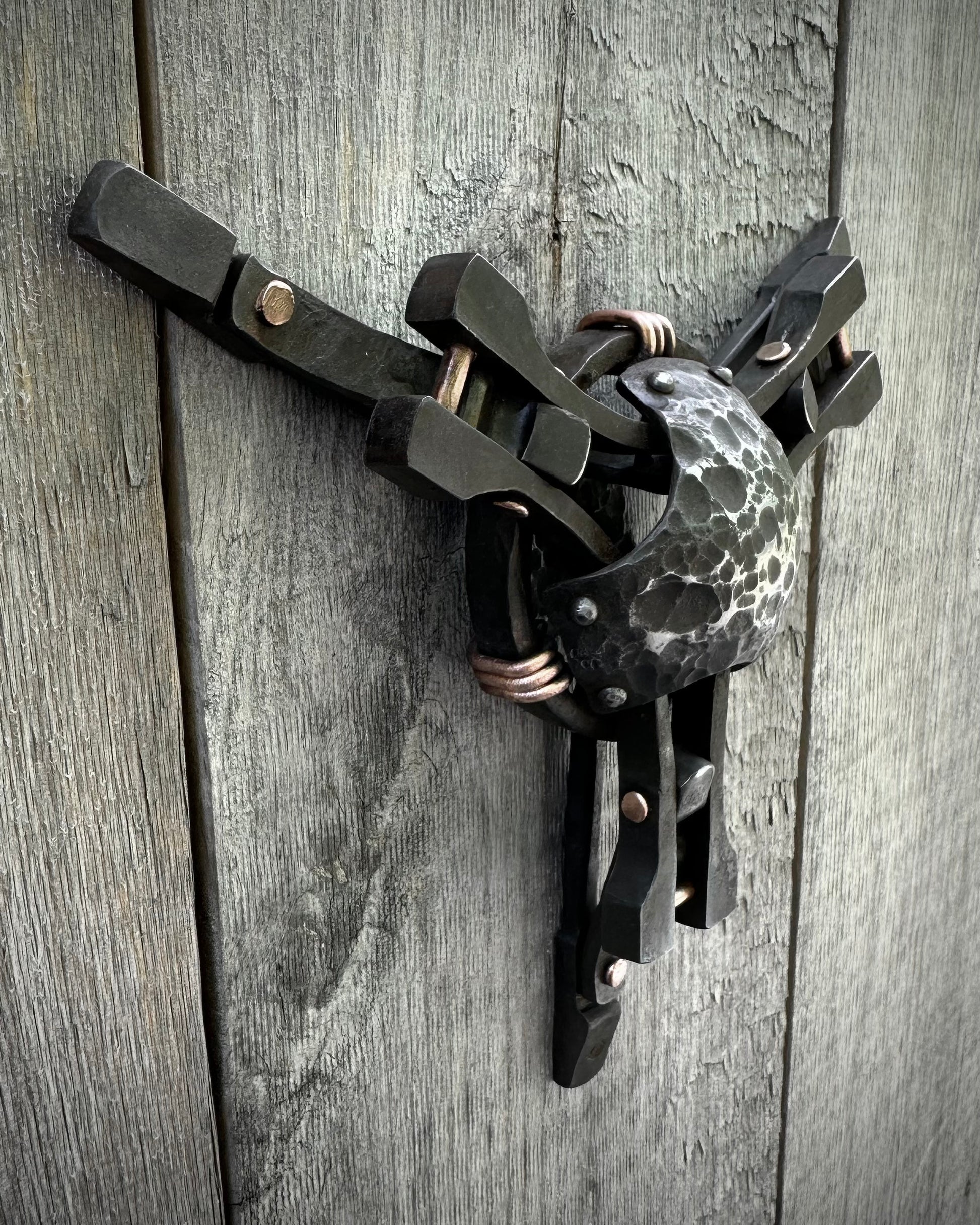 Forged steel & copper with waxed hot finish.