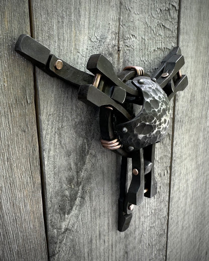 Forged steel & copper with waxed hot finish.