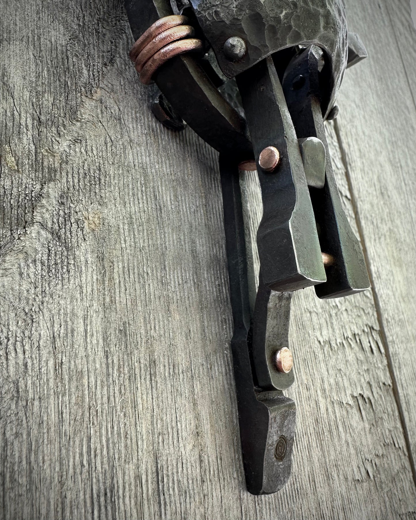 Forged steel & copper with waxed hot finish.