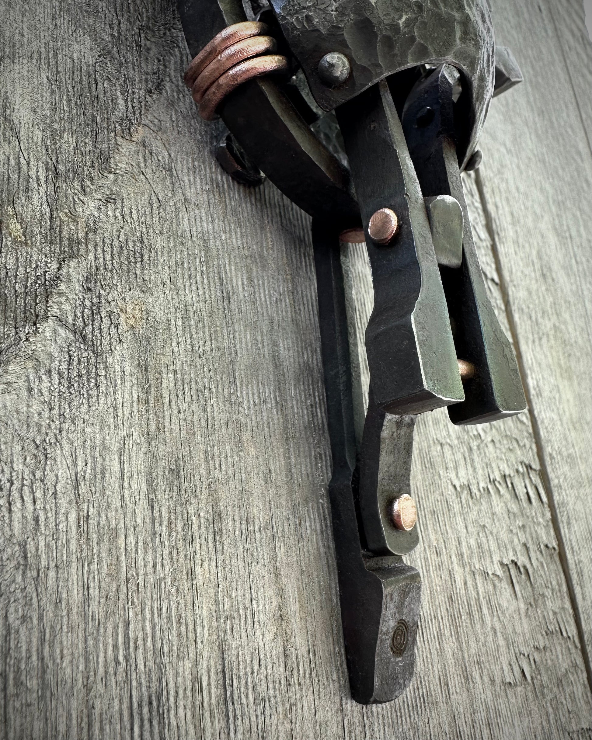 Forged steel & copper with waxed hot finish.