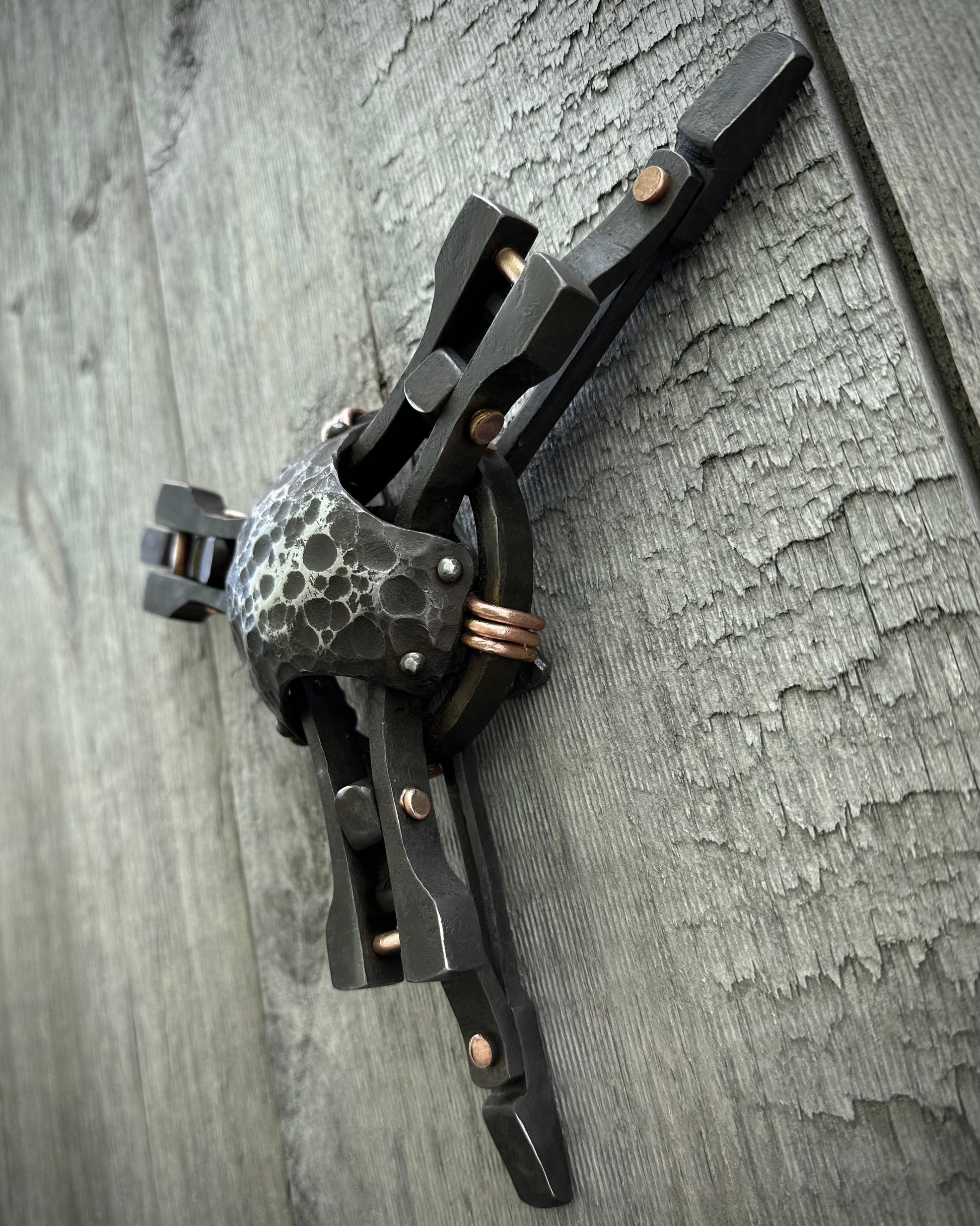 Forged steel & copper with waxed hot finish.