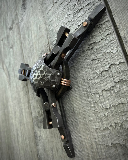 Forged steel & copper with waxed hot finish.