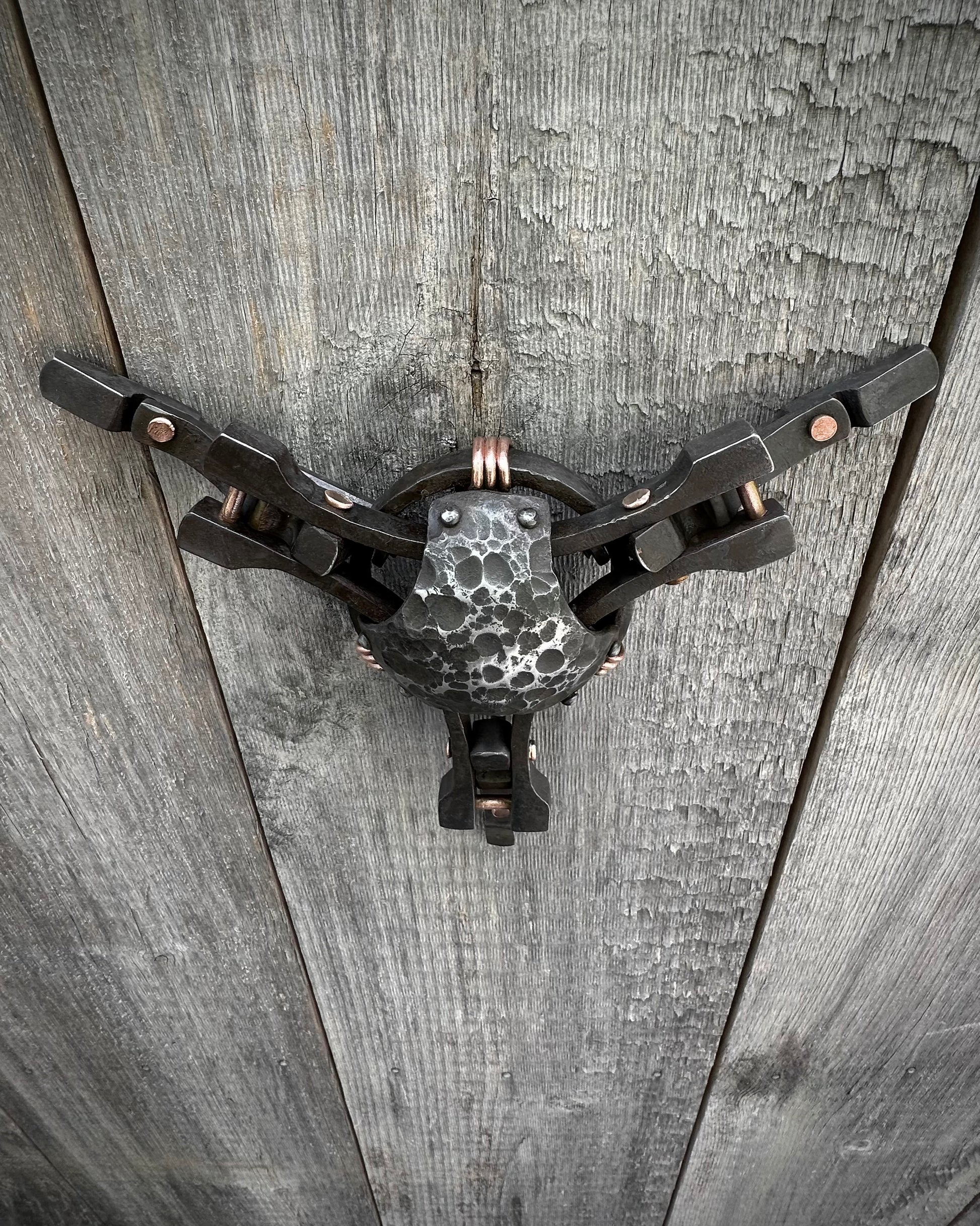 Forged steel & copper with waxed hot finish.